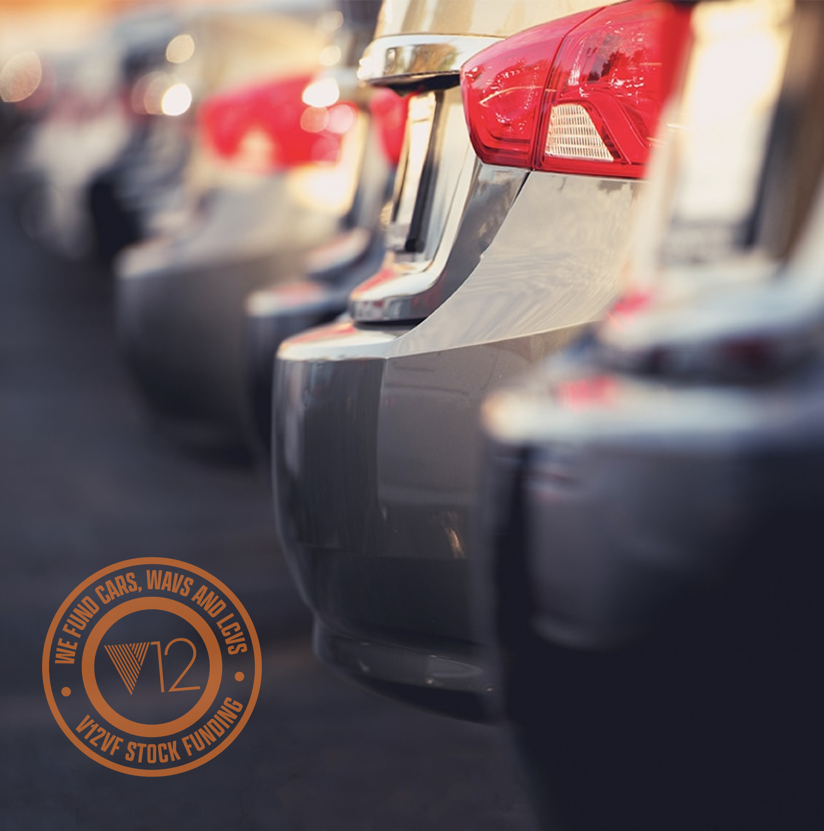 a close up of modern cars lined up on a forecourt