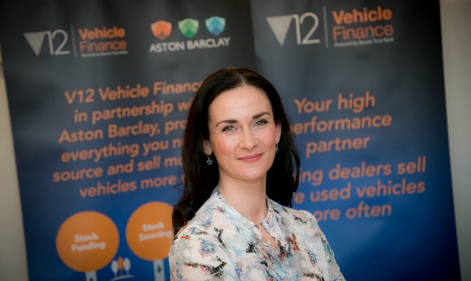 Ciara Raison in front of V12 Vehicle Finance Baners