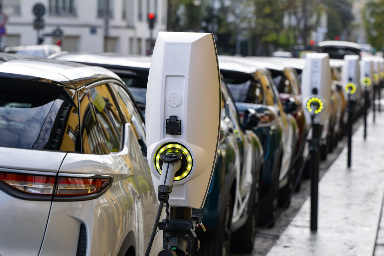 EV cars charging on a street