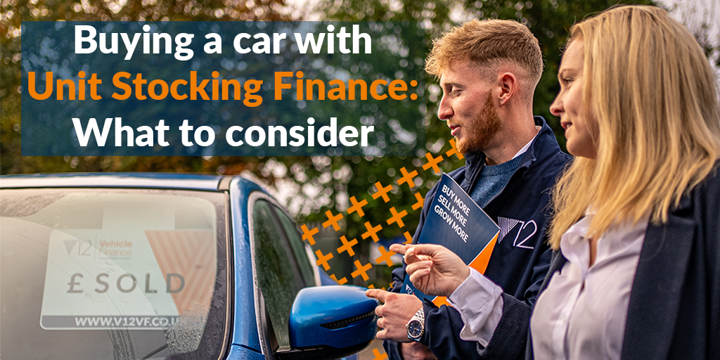 A dealer and an account manager looking at a vehicle on a forecourt